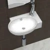 A white ceramic sink with a chrome faucet is mounted on a white shelf against a dark brown tiled wall. Anteprima dell’immagine prodotto
