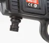 Close-up of a black plastic fitting on a device, with a red label in the background. Náhled obrázku produktu