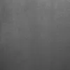 A close-up, full-frame shot of a gray upholstered armchair. Produktbild-Vorschau