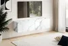 A modern living room with a wall-mounted TV cabinet and a television. Voir les images du produit