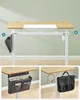 A height-adjustable desk with accessories attached. Produktbild-Vorschau