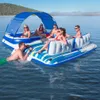 People relaxing on an inflatable raft on a lake. Produktbild-Vorschau