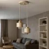 A modern living room with a double pendant light fixture hanging over a sofa. Produktbild-Vorschau