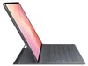 A black Samsung tablet with a keyboard case, shown from a side angle with the screen displaying a pink and orange abstract pattern. Produktbild-Vorschau
