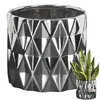 A silver ceramic planter with a geometric pattern is shown on a white background. A smaller, similar planter with a snake plant is in the lower right corner. Anteprima dell’immagine prodotto