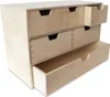 A light-colored wooden chest of drawers with six drawers, some of which are open. Produktbild-Vorschau
