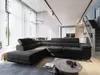 A modern living room with a large sectional sofa, coffee table, and stairs leading to an upper level. Produktbild-Vorschau