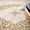 A close-up of a textured rug with an ornate pattern. Produktbild-Vorschau