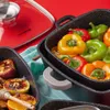 A close-up shot of cookware filled with colorful bell peppers and grilled fruits, set against a vibrant red background. Náhled obrázku produktu