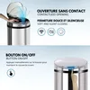 A split image showing a stainless steel automatic trash can with its lid open and a hand reaching towards it, and a close-up of the lid with a finger pressing a button. Anteprima dell’immagine prodotto
