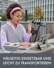 A woman is working on a tablet outdoors at a table, with a scooter in the background. Produktbild-Vorschau