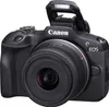 A black Canon EOS R100 camera with a lens attached, shown from the front. Voir les images du produit