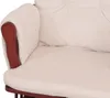A close-up view of the armrest and seat cushion of a cream-colored corduroy armchair. Voir les images du produit