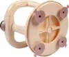 The underside of a beige baby bathtub seat with pink suction cups. Produktbild-Vorschau