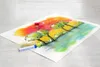 A drawing of a landscape with trees and a river, with pastel crayons and erasers on top. Náhľad obrázku produktu