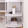 A white corner shelf unit with items on display. Produktbild-Vorschau