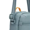 A close-up view of a blue crossbody bag with a strap and zipper. Voir les images du produit