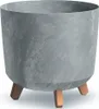 A close-up studio shot of a gray planter with a concrete effect and three brown wooden legs. Voir les images du produit