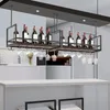 A wine rack with glasses hanging below, installed in a kitchen or bar area. Náhľad obrázku produktu