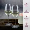 Two wine glasses filled with white wine are placed on a wooden surface, with a soft pink floral arrangement in the background. The right side of the image features text and icons highlighting product features. Náhľad obrázku produktu