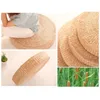 A collage of images showing a round woven floor cushion, its texture, and a close-up of cattails. Produktbild-Vorschau