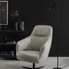 A modern living room corner with a chair and a floor lamp. Produktbild-Vorschau