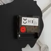 Close-up view of the back of a wall clock, showing the battery compartment and movement mechanism. Anteprima dell’immagine prodotto