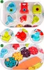 A collage of close-up shots of a baby activity table, showcasing different interactive elements like shape sorters, gears, and locks. Podgląd zdjęcia produktu