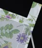 A close-up view of a floral patterned fabric, likely a curtain or blind, with a black background. Produktbild-Vorschau