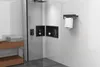 A modern bathroom with a shower enclosure, shelves, and a towel rack. Anteprima dell’immagine prodotto