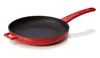A red cast iron frying pan with a black interior, shown from a side-diagonal angle on a white background. Voir les images du produit