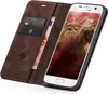A brown leather flip case for a Samsung Galaxy S7 phone, with cards and banknotes inserted. Produktbild-Vorschau