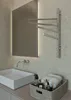 A modern bathroom with a sink, mirror, and a heated towel rack. Podgląd zdjęcia produktu
