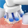 Close-up of an electric toothbrush head cleaning teeth, showing plaque removal. Produktbild-Vorschau