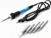 A soldering iron set with multiple tips is laid out on a white background. Voir les images du produit