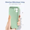 A hand holding a light green phone case against a white background. Produktbild-Vorschau