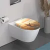 A toilet with a decorative seat cover featuring a beach scene with a starfish at sunset. Anteprima dell’immagine prodotto