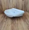 A white corner sink is placed on a wooden floor. Anteprima dell’immagine prodotto