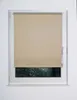 A roller blind is shown covering most of a window, with a view of trees and foliage visible through the uncovered lower portion of the window. Produktbild-Vorschau