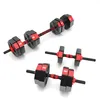 Three adjustable dumbbells on a white background. Produktbild-Vorschau