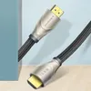 Two HDMI cables are shown diagonally against a light blue and white background, with a hint of a blue object on the left and a wooden floor at the bottom. Anteprima dell’immagine prodotto