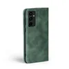 A green flip case for a smartphone is shown against a white background. Produktbild-Vorschau