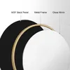 A diagram showing the layered construction of a round mirror, with labels pointing to the MDF back panel, metal frame, and glass mirror. Produktbild-Vorschau