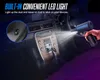 A hand holding a black air duster inside a car, with a beam of light coming from the nozzle. Podgląd zdjęcia produktu