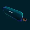 A dark background with a Bose SoundLink Flex portable Bluetooth speaker. Produktbild-Vorschau
