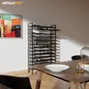 A modern dining room with a wine rack filled with bottles, a table with a plate, and a chair. Anteprima dell’immagine prodotto