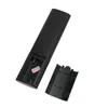 The back of a black remote control with the battery compartment open. Produktbild-Vorschau