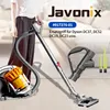 A person holding a vacuum cleaner handle with the vacuum cleaner base and a spare handle and brushes visible on the floor. Produktbild-Vorschau