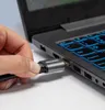 A hand is plugging a Unitek HDMI cable into a laptop. Podgląd zdjęcia produktu