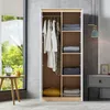 An open wardrobe with clothes hanging and folded items on shelves. Produktbild-Vorschau